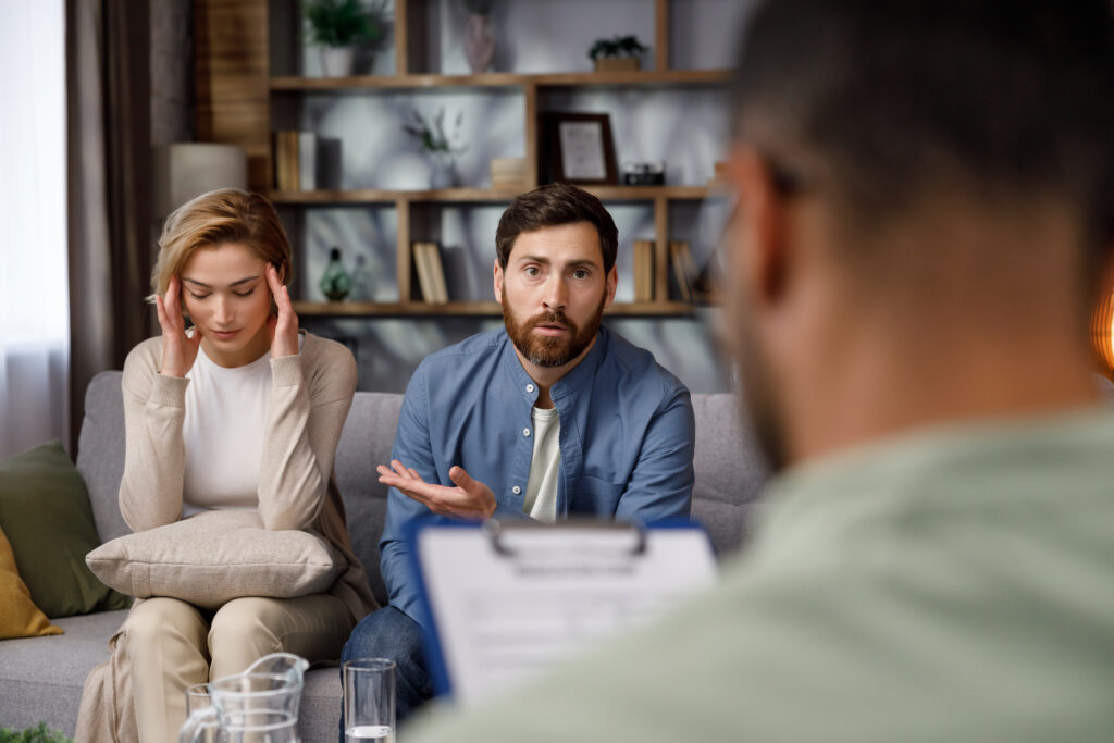 Image of a professional setting where a Divorce Mediation Attorney is guiding a couple through divorce negotiation