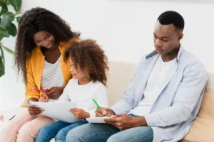 Family working together at table illustrating California parenting plan and shared custody responsibilities.